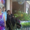 Bonni, Joplin Java proprietor Alice Alviani, and Gloria Shannon beside the piano planter in Waukegan, July 2011
